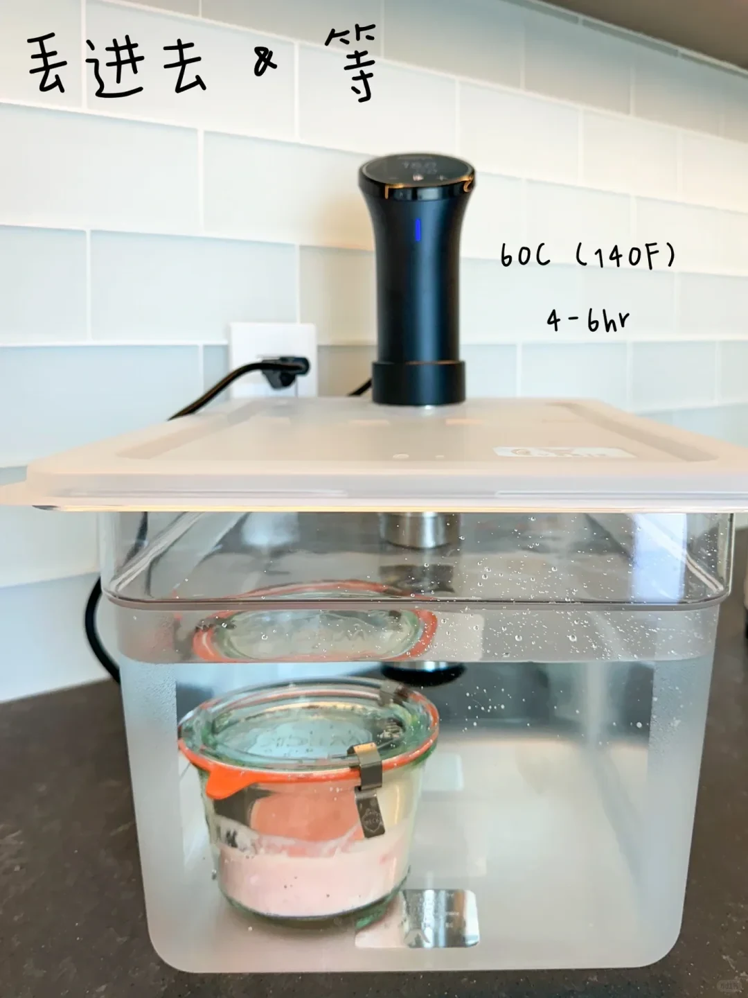 A clear sous vide container filled with water holds a sealed Weck glass jar submerged at the bottom, heated by an Anova immersion circulator mounted through the lid, with handwritten annotations indicating the temperature and cooking time.