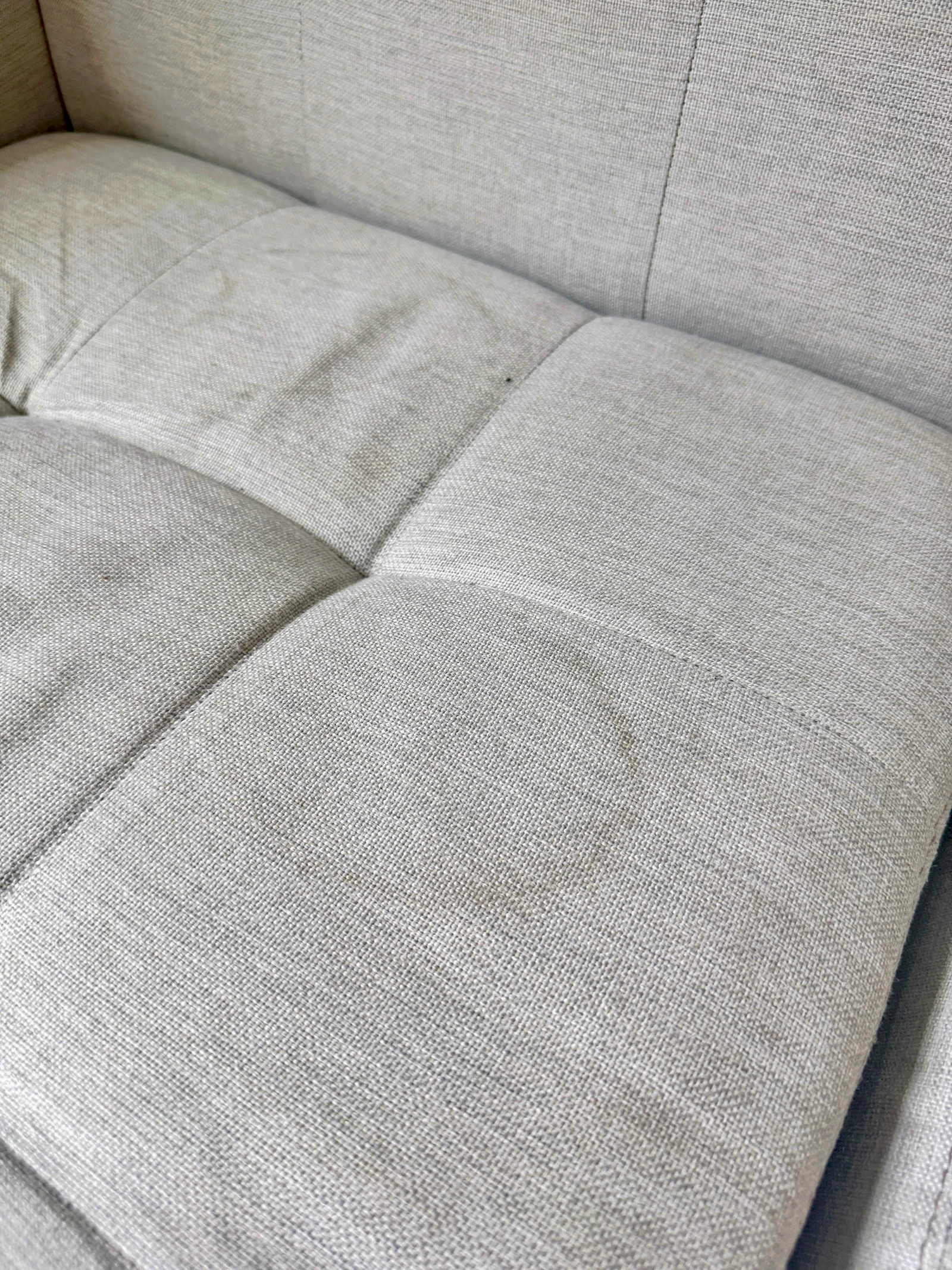 The sofa seat fabric photographed for the owner’s comparison.