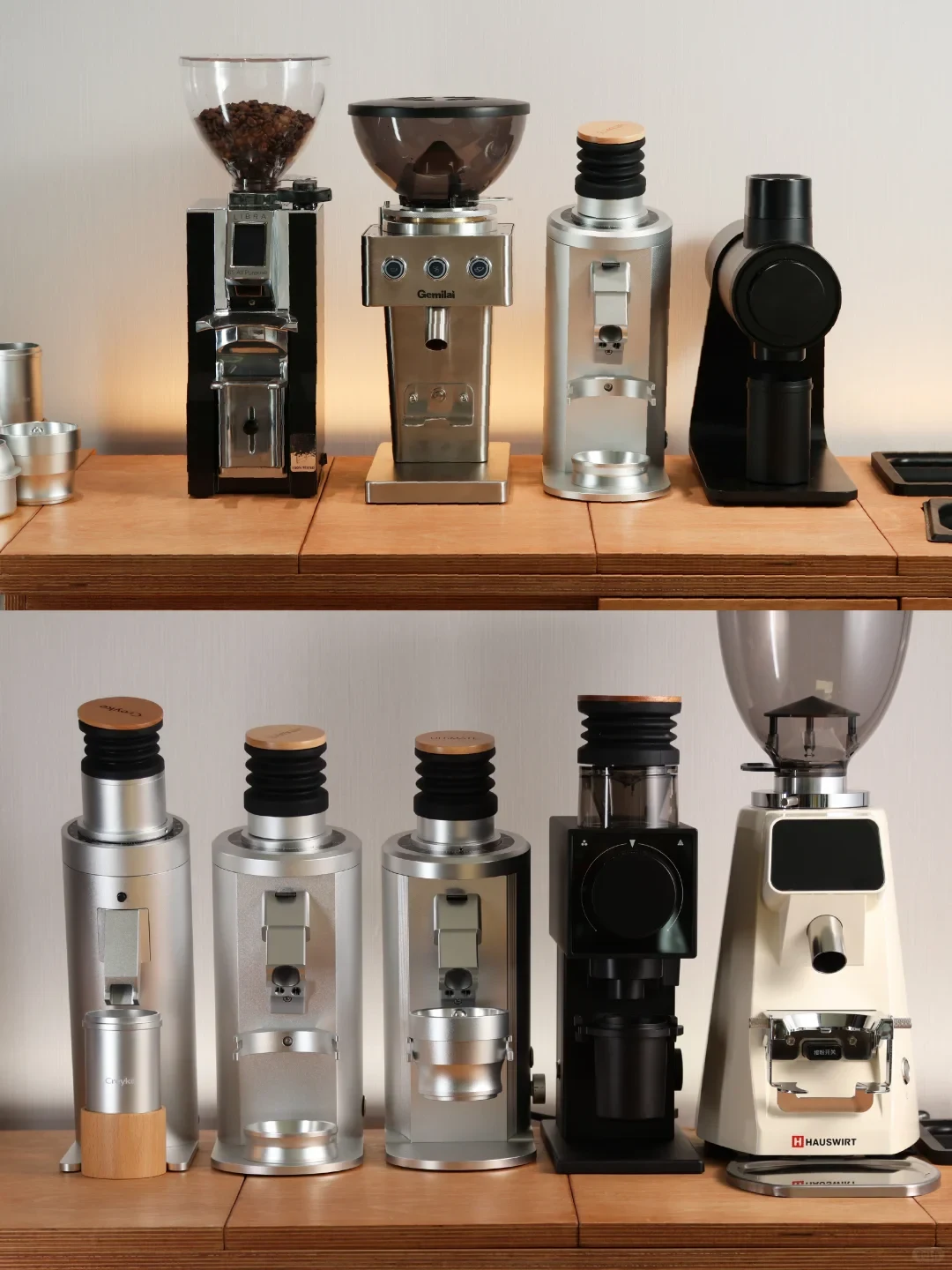 A two-panel product photo shows several coffee grinders lined up on wooden tables. The top panel includes four grinders, and the lower panel shows five more, mostly silver or black, with bean hoppers, adjustment controls, and grounds outlets.