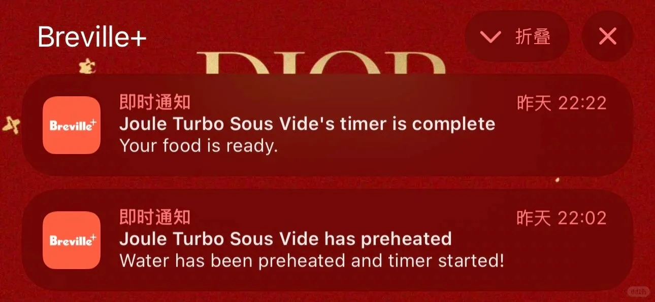 A mobile screen displaying two Breville+ push notifications over a dark red backdrop. The top notification states 'Joule Turbo Sous Vide's timer is complete. Your food is ready.' The bottom notification states 'Joule Turbo Sous Vide has preheated. Water has been preheated and timer started!' Each notification includes Chinese system labels for notification type and timestamp.