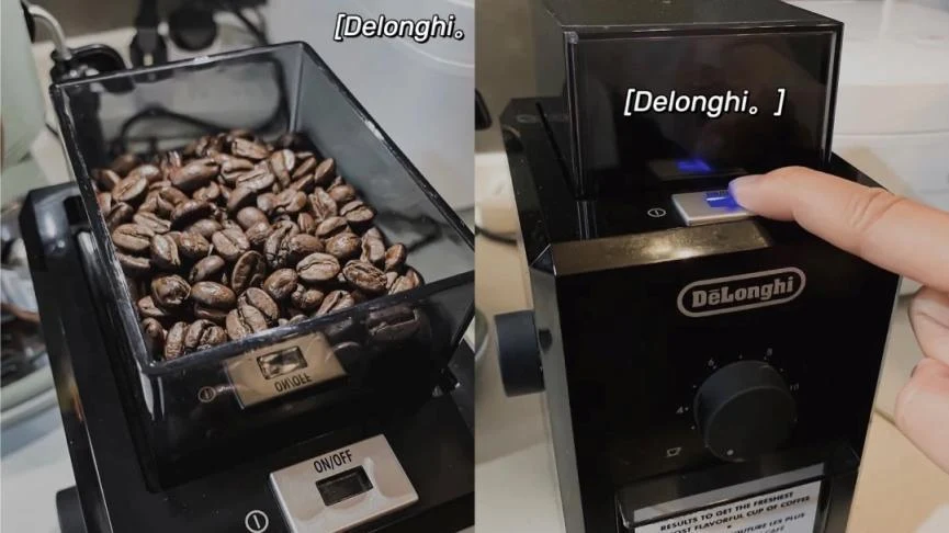 Split view of a black De'Longhi coffee grinder, showing coffee beans in the hopper on the left and a finger pressing the power button on the right.