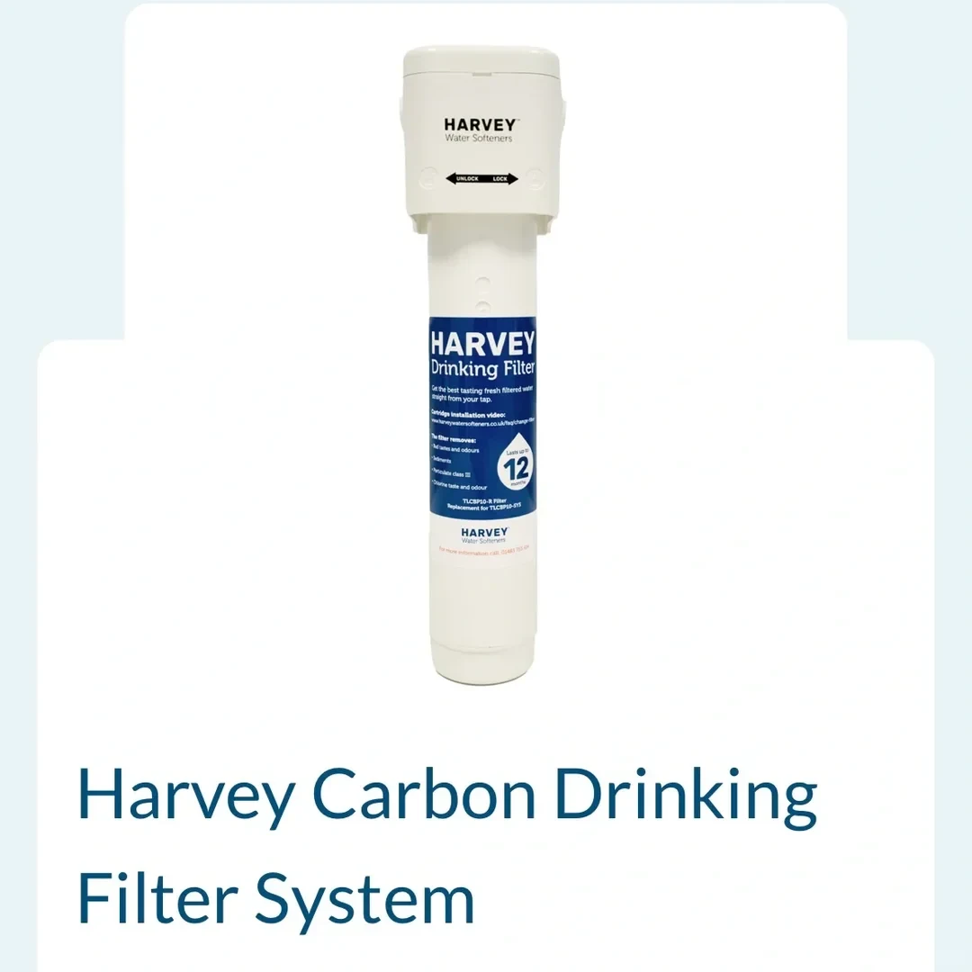 Product listing image for the Harvey Carbon Drinking Filter System, displaying a tall white cylindrical water filter cartridge mounted in a white bracket, with the product name written in blue below.