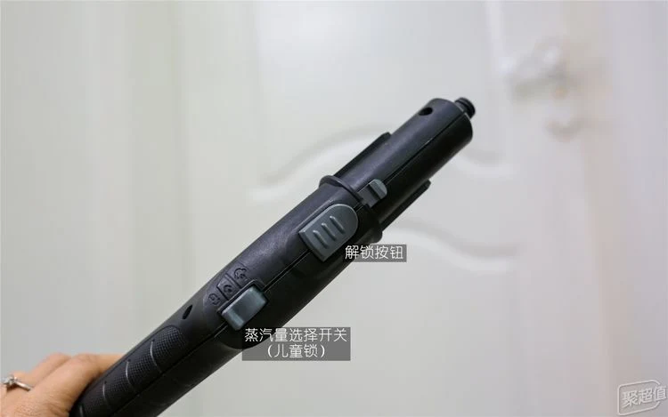 Close-up view of the black handle on the Kärcher SC3 steam cleaner, showing the sliding unlock button and the steam volume selection switch with child safety lock icons.