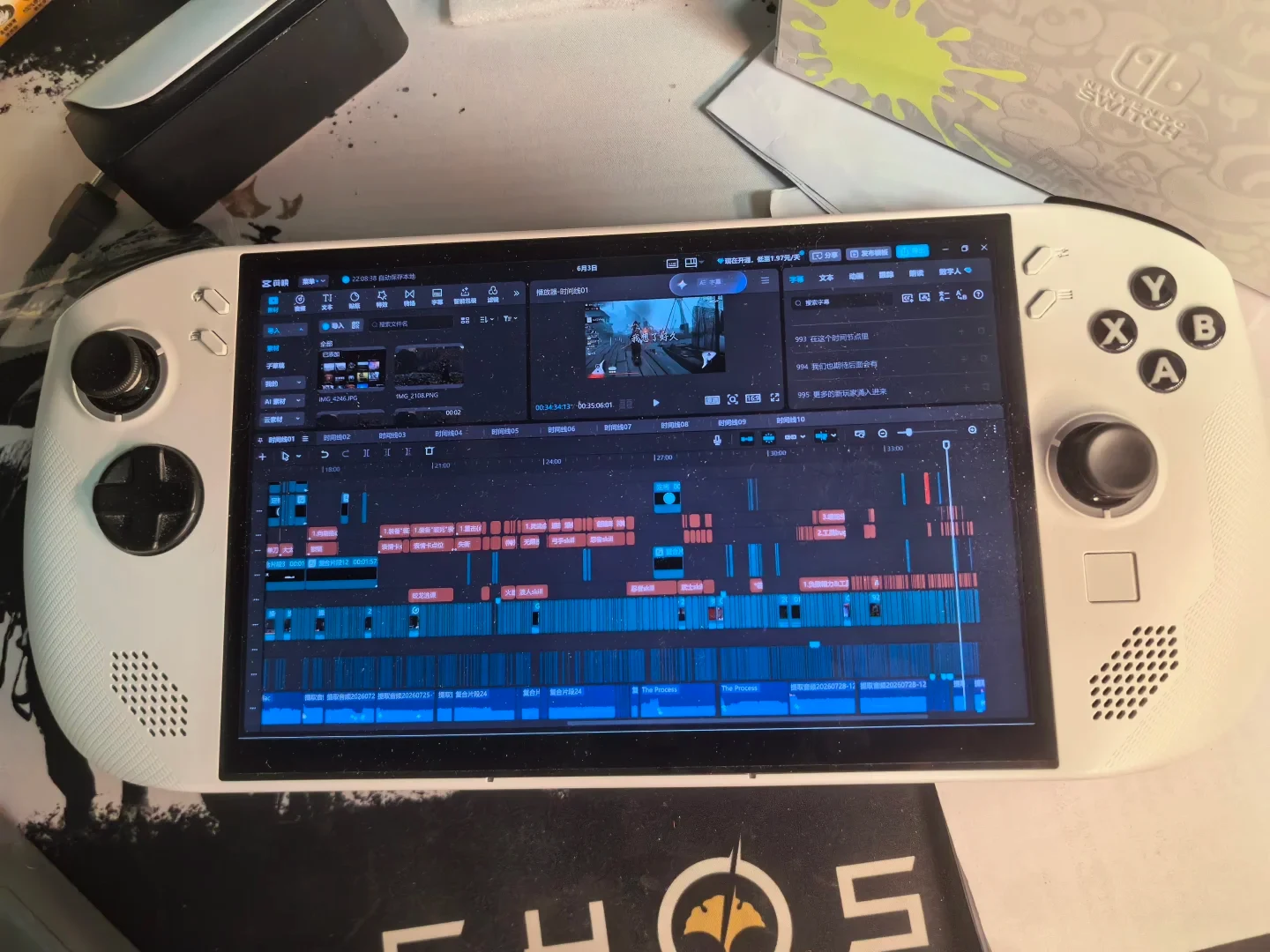 A white handheld gaming PC displaying a video editing timeline in CapCut (Jianying) on its screen, with multiple audio and video tracks shown.