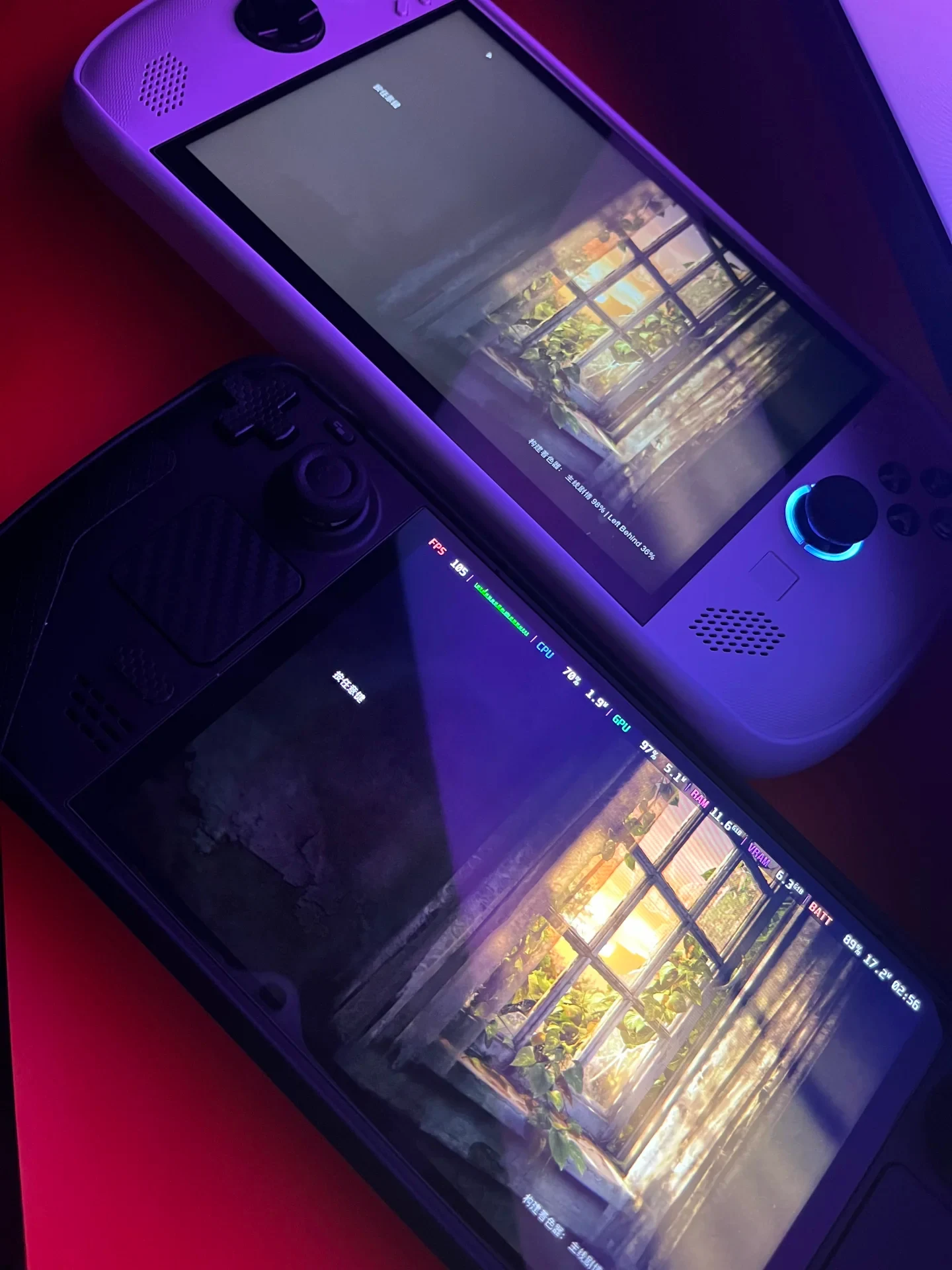 A white Lenovo Legion Go S and a black Steam Deck side by side, displaying The Last of Us shader-compilation screens under purple lighting.