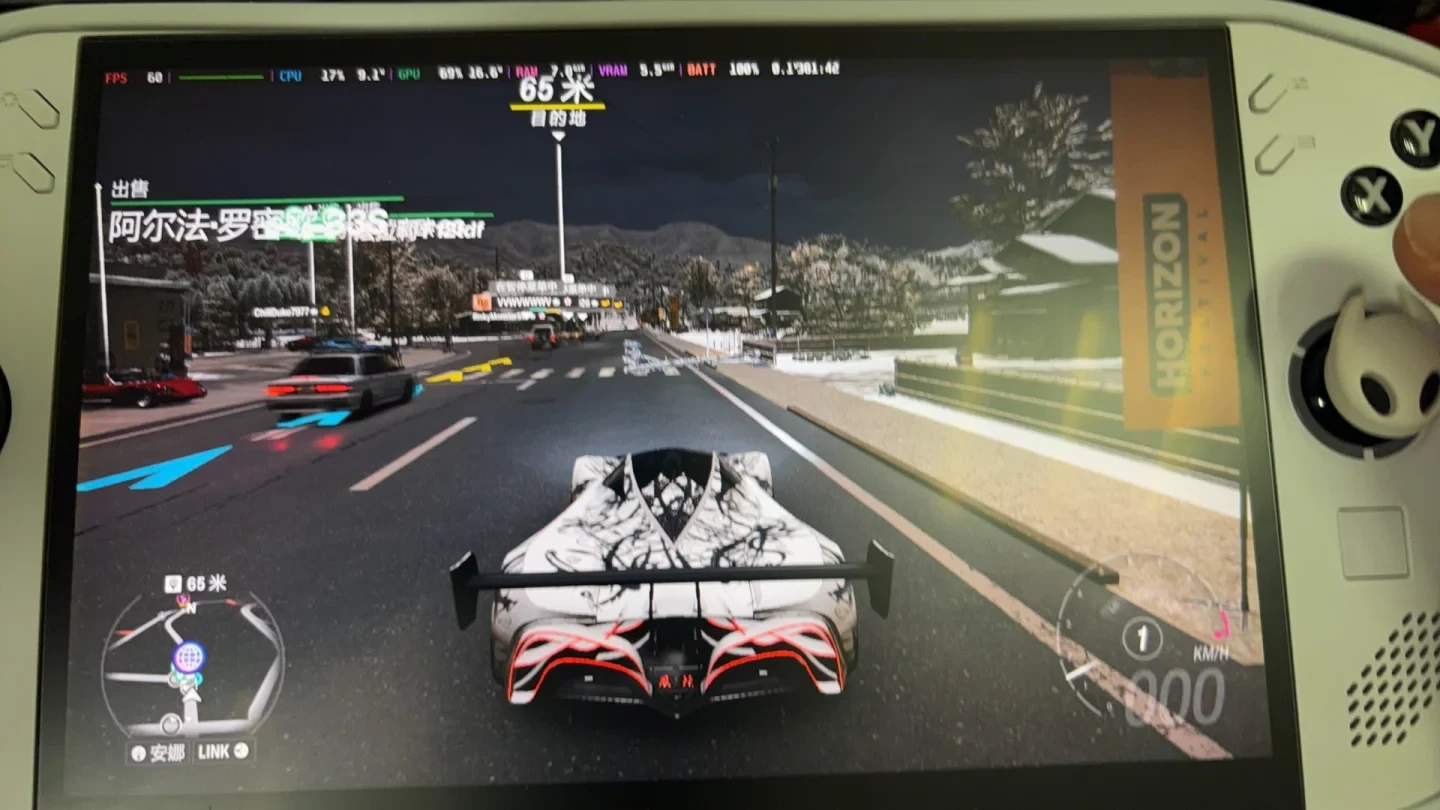 Handheld gaming console running a racing video game showing a futuristic white patterned sports car driving down a roadway.
