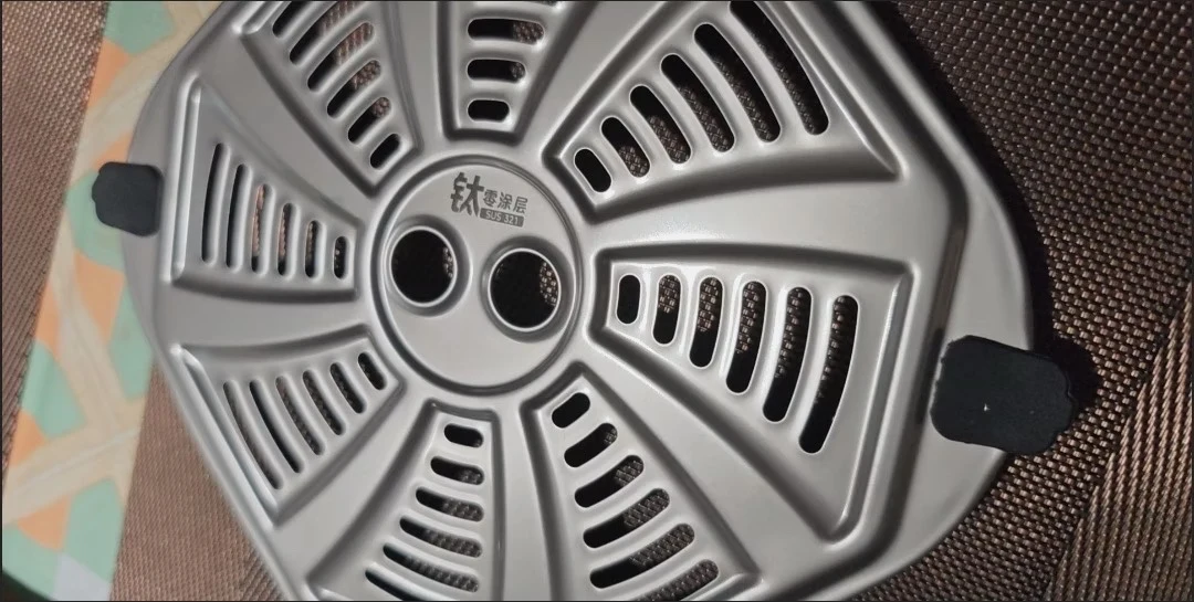 The removable perforated cooking insert.