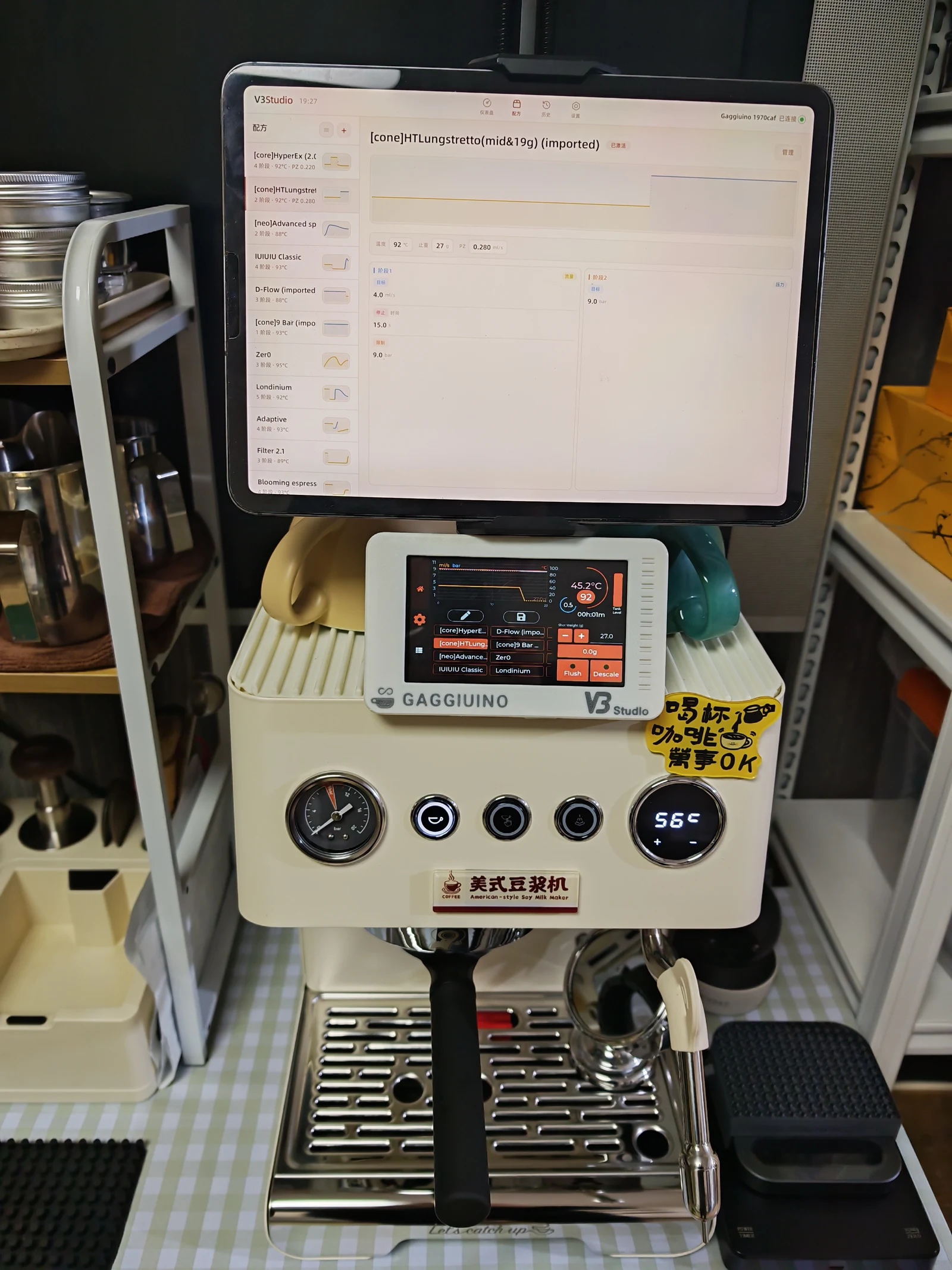 The modified coffee machine beneath a tablet displaying extraction data.