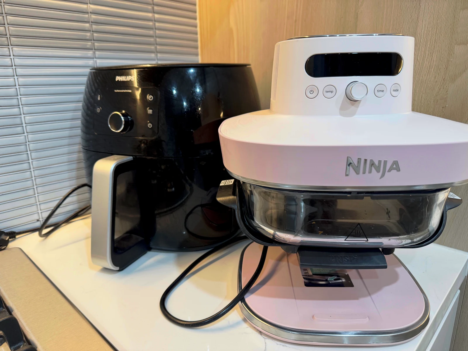 The Ninja Crispi Pro beside the owner’s Philips XXL.