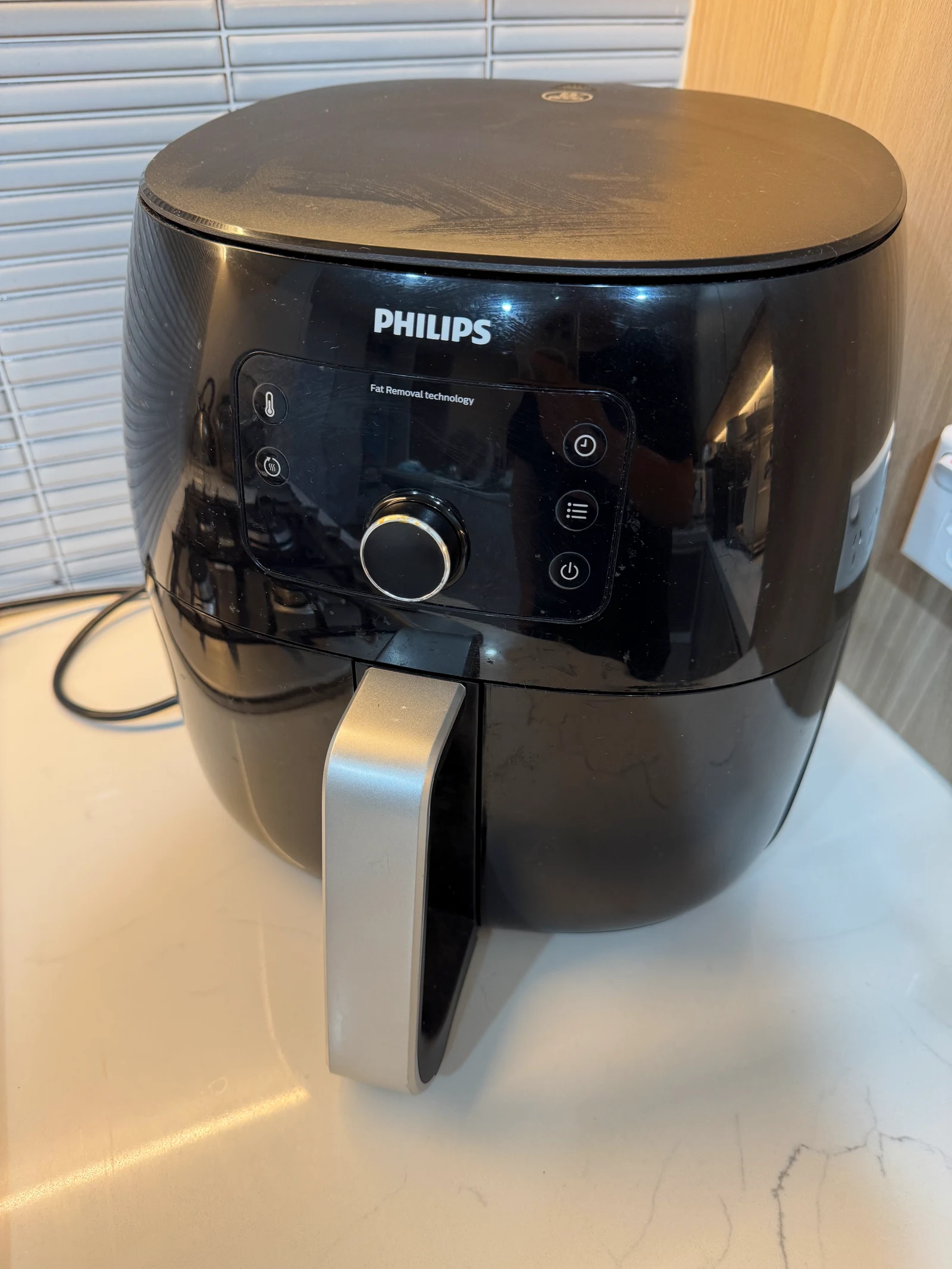 The older Philips XXL with its front dial and drawer.