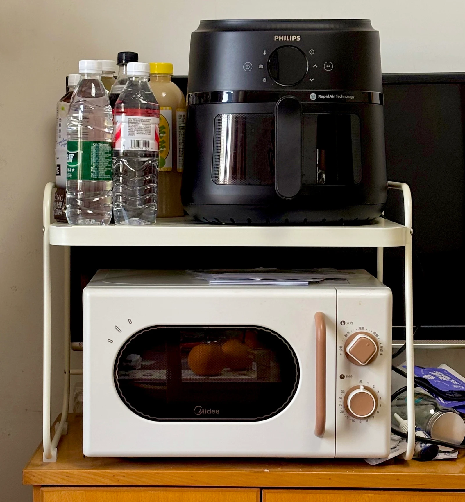 The NA230 on a shelf above a small oven.