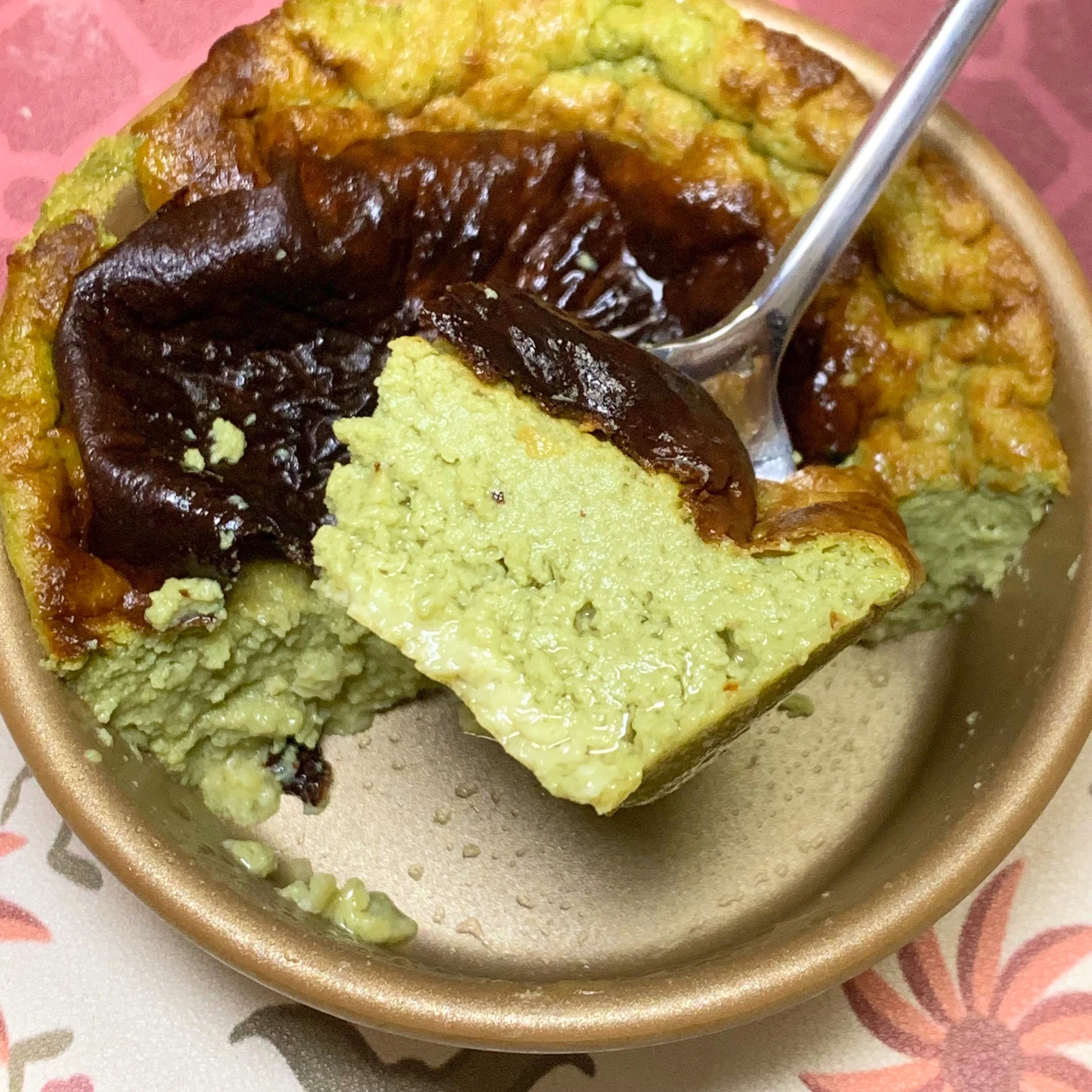 A spoonful of the green cheesecake.