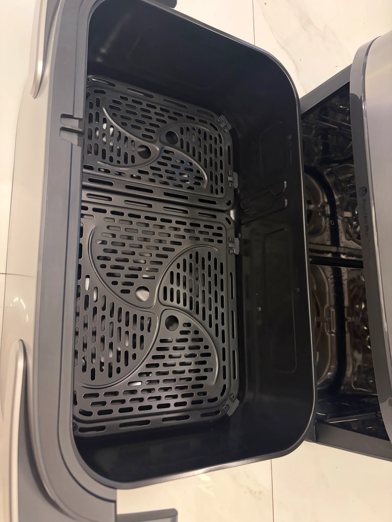 The removable basket, divider and perforated cooking inserts.