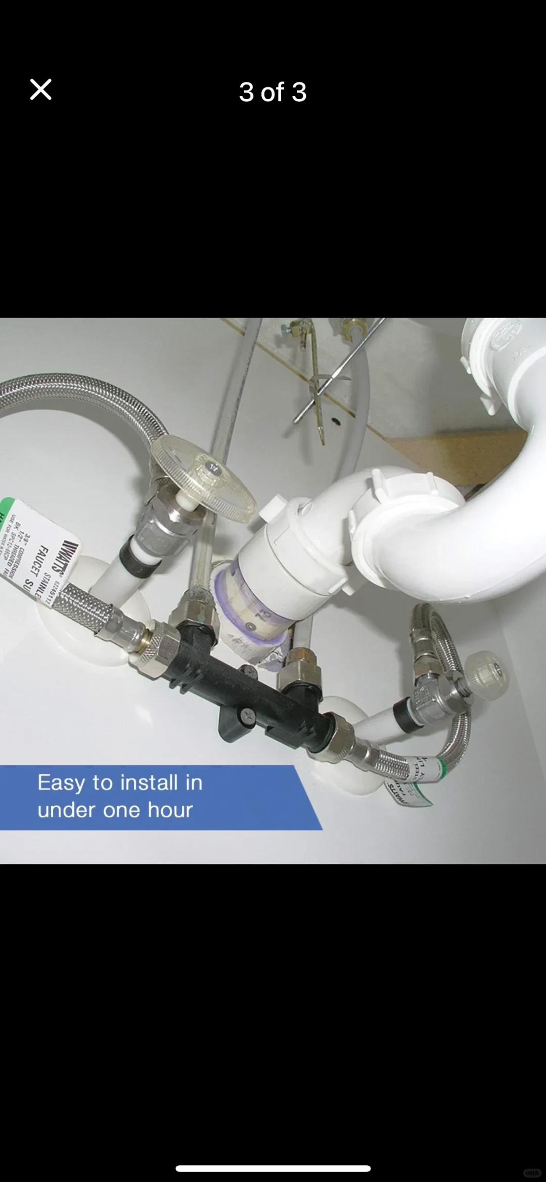 A phone gallery screenshot labeled “3 of 3” shows plumbing beneath a sink: braided metal hoses and a black valve assembly connected to white pipes. A blue caption says, “Easy to install in under one hour.”