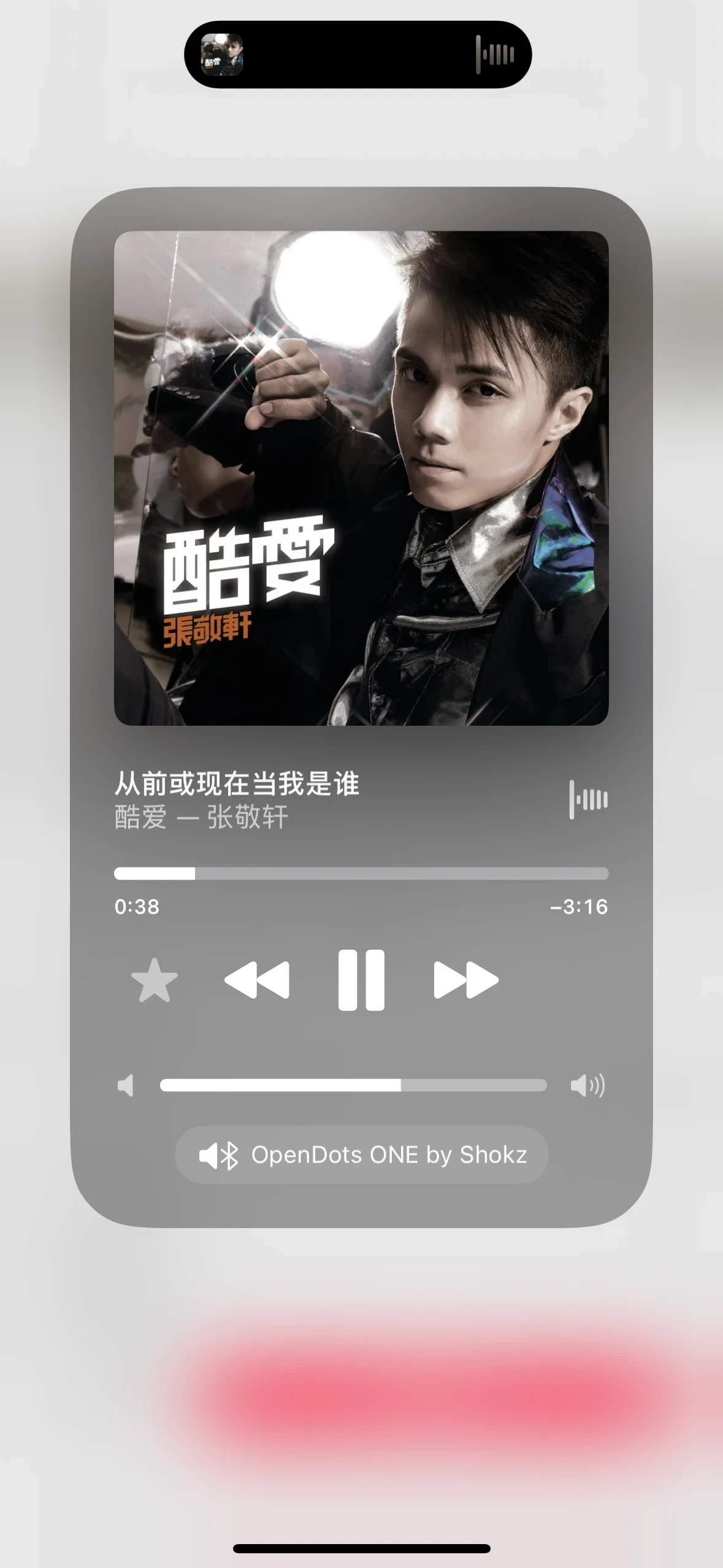 An iPhone music-player screenshot from the source post with OpenDots ONE by Shokz selected as the audio output.
