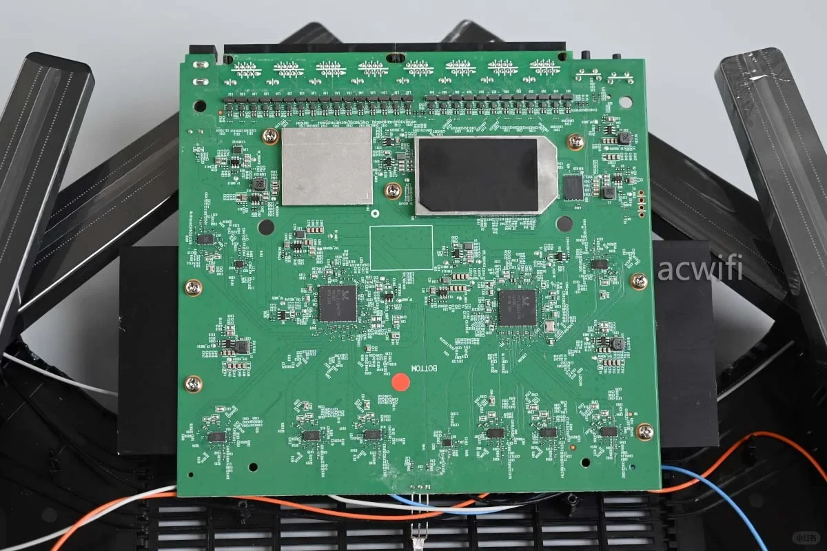 Top-down view of the green printed circuit board inside the disassembled TP-LINK 7DR7290 router, showing Realtek chips, RF components, and metal shielding.