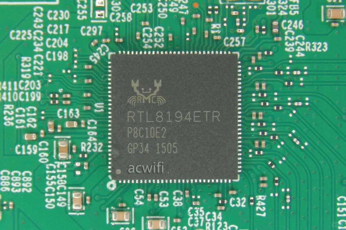A close-up view of the Realtek RTL8194ETR chip mounted on a green printed circuit board, surrounded by surface-mount components and circuit traces.